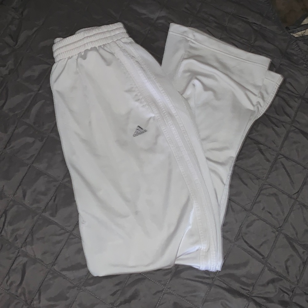 All white Adidas track pants